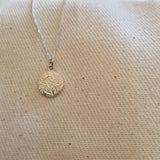 Round floral disc necklace