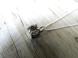 white topaz claw set pendant