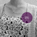 white topaz claw set pendant