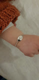 Baby bracelet with cut out initial