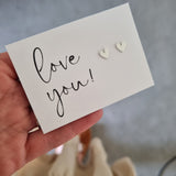 heart earrings on Love you card