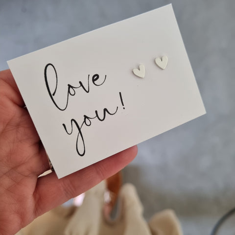heart earrings on Love you card
