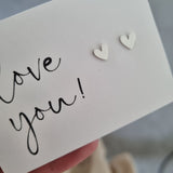 heart earrings on Love you card
