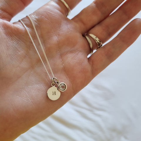 Initial necklace with white topaz